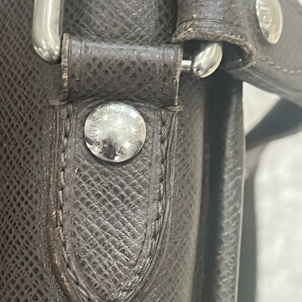 Louis Vuitton Taiga Roman Leather Messenger Bag.